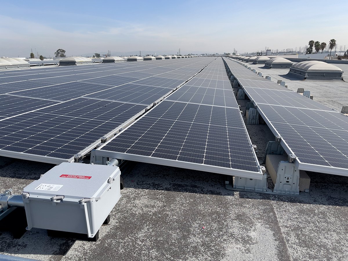 The system features 840 solar panels mounted on the roof