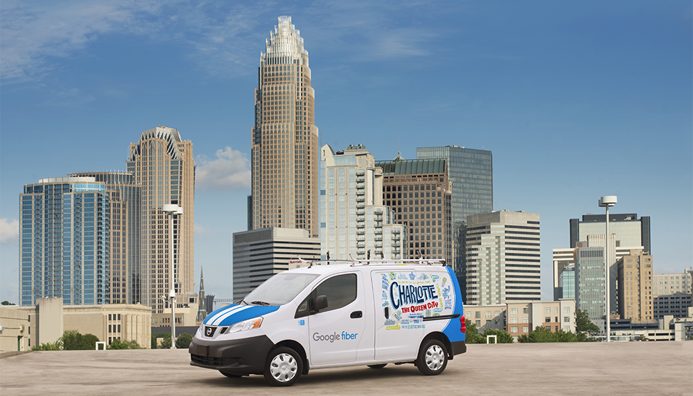 Google Fiber van in front of Charlotte skyline