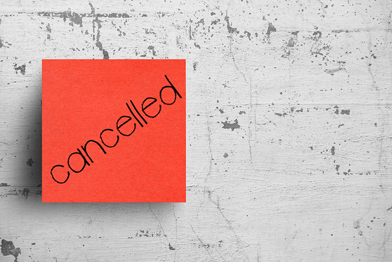 Cancelled written on sticky note