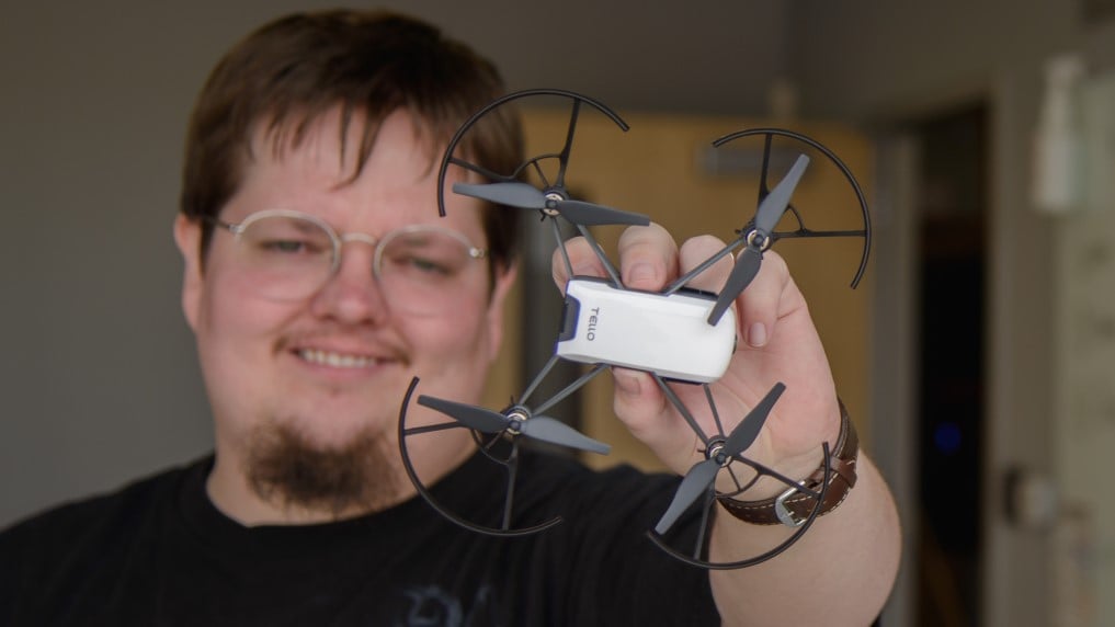 man holding small drone