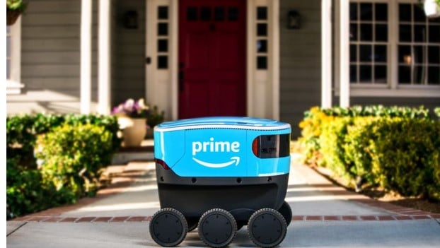 picture of blue cooler sized robot in front of home