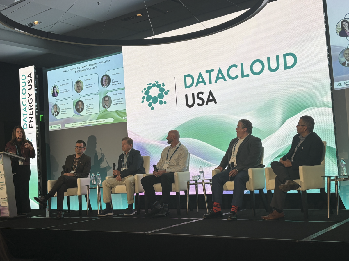 Five panelists on stage at Datacloud USA