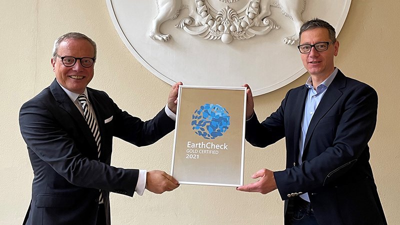 General Manager Holger Schroth and Technical Manager Frank Schroede pose with the EarthCheck Gold Certification 