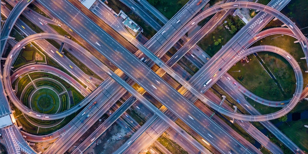 highway on-ramp cars via Getty Images