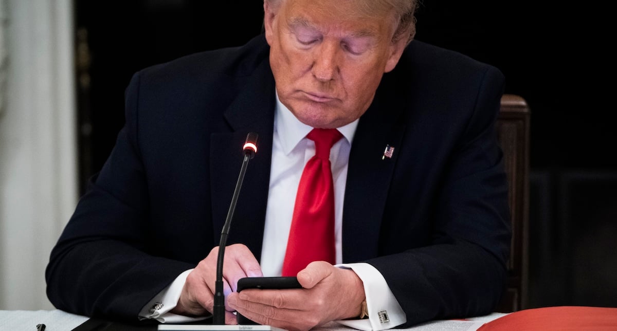 President Trump using a mobile phone in 2020 via Getty Images