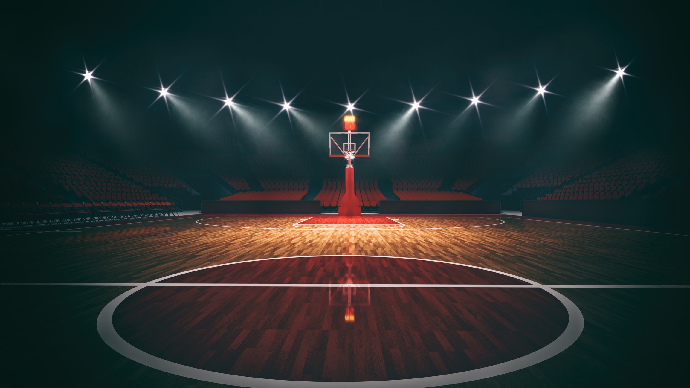 Interior view of an illuminated basketball stadium for a game
