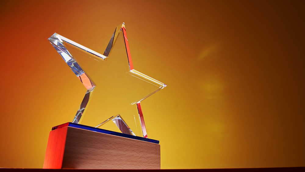 star shaped award on a platform