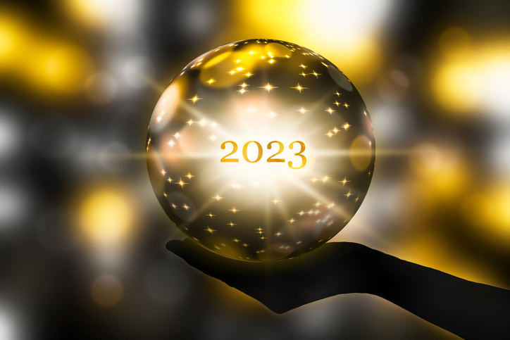Fortune telling 2023 with a crystal ball in a hand festive atmosphere