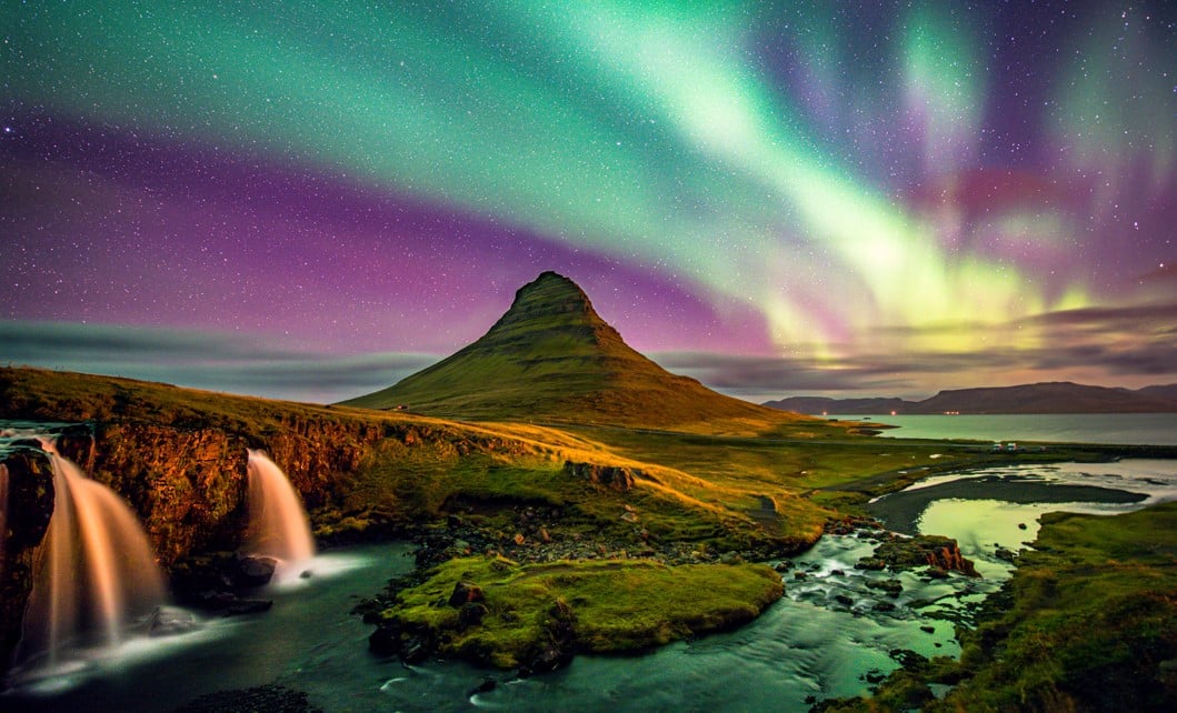 waterfalls northern lights mountain in iceland
