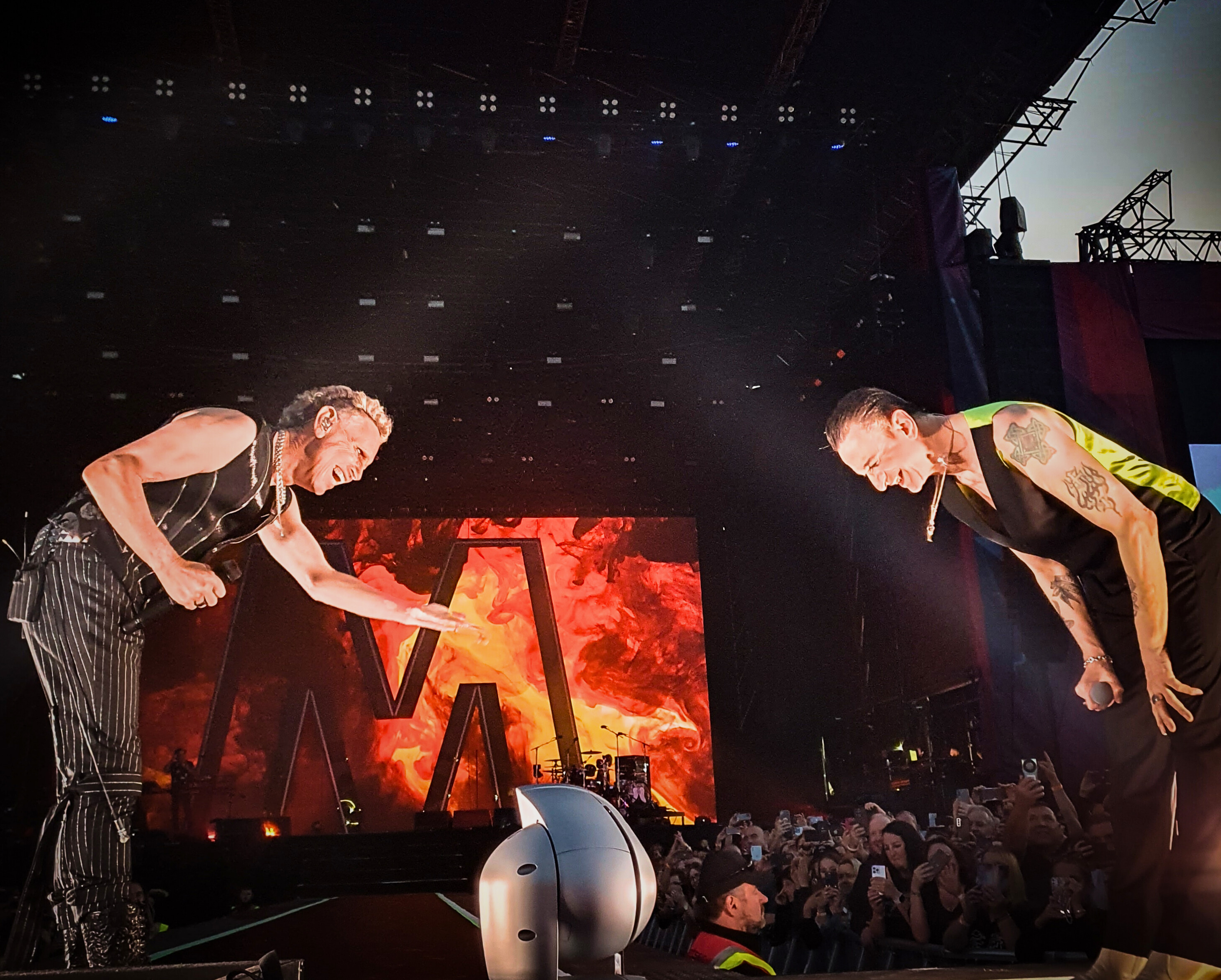 Dave Gahan and Martin Gore bow in front of LED Screen 