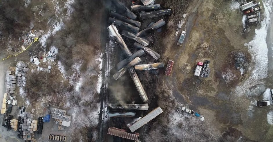 shows freight cars from air mangled after derailment