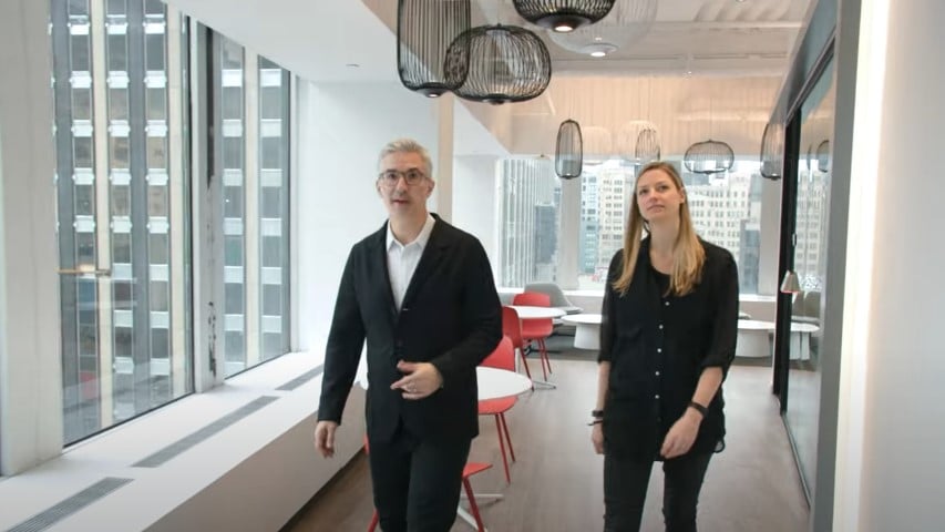 two people walking through office of cisco
