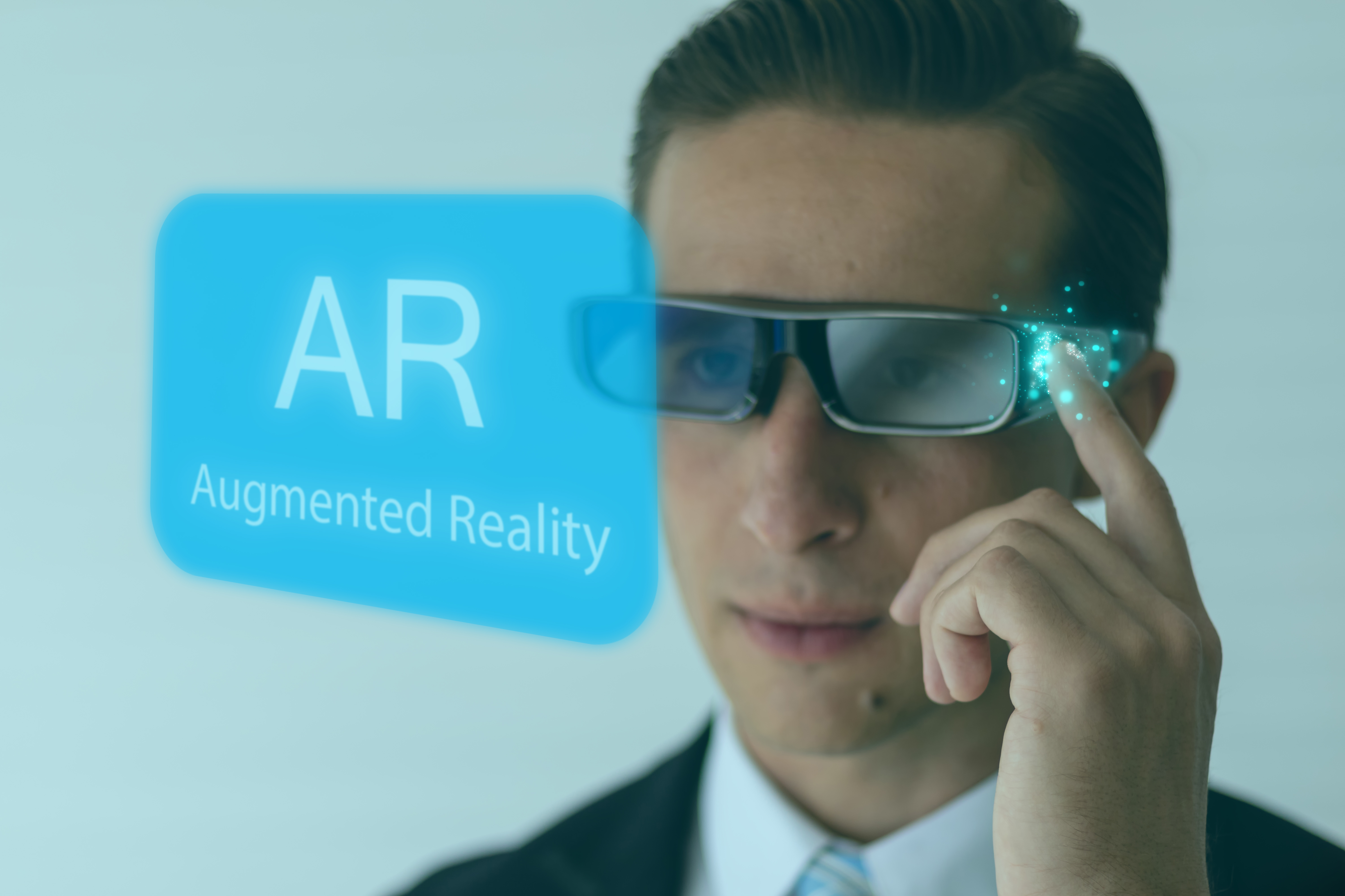 Man wearing augmented reality glasses with words in background