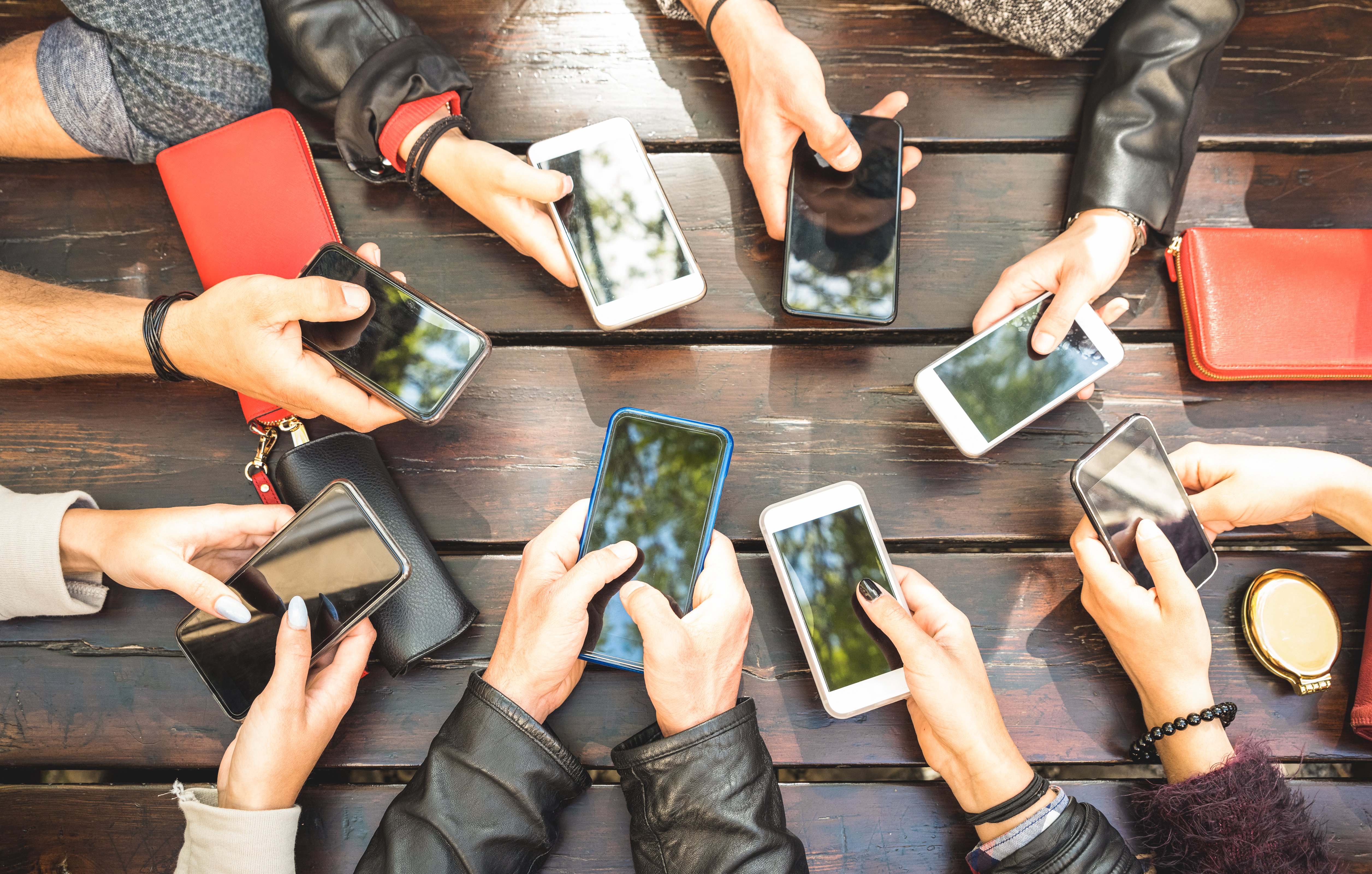group of people with smartphones