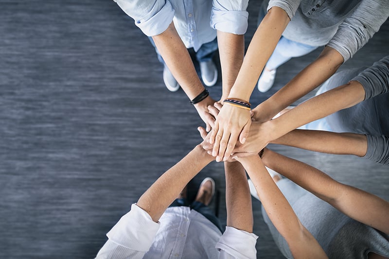 Stack of hands Unity and teamwork concept