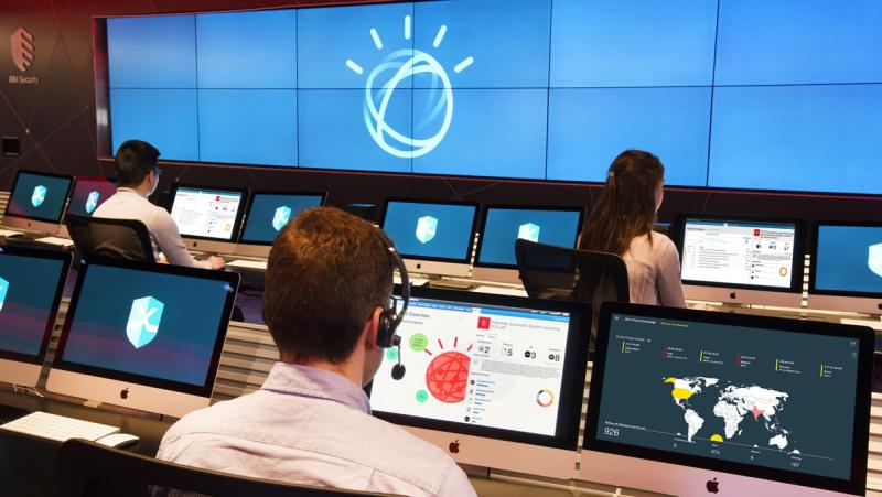 engineers sit in control room where IBM watson is managed