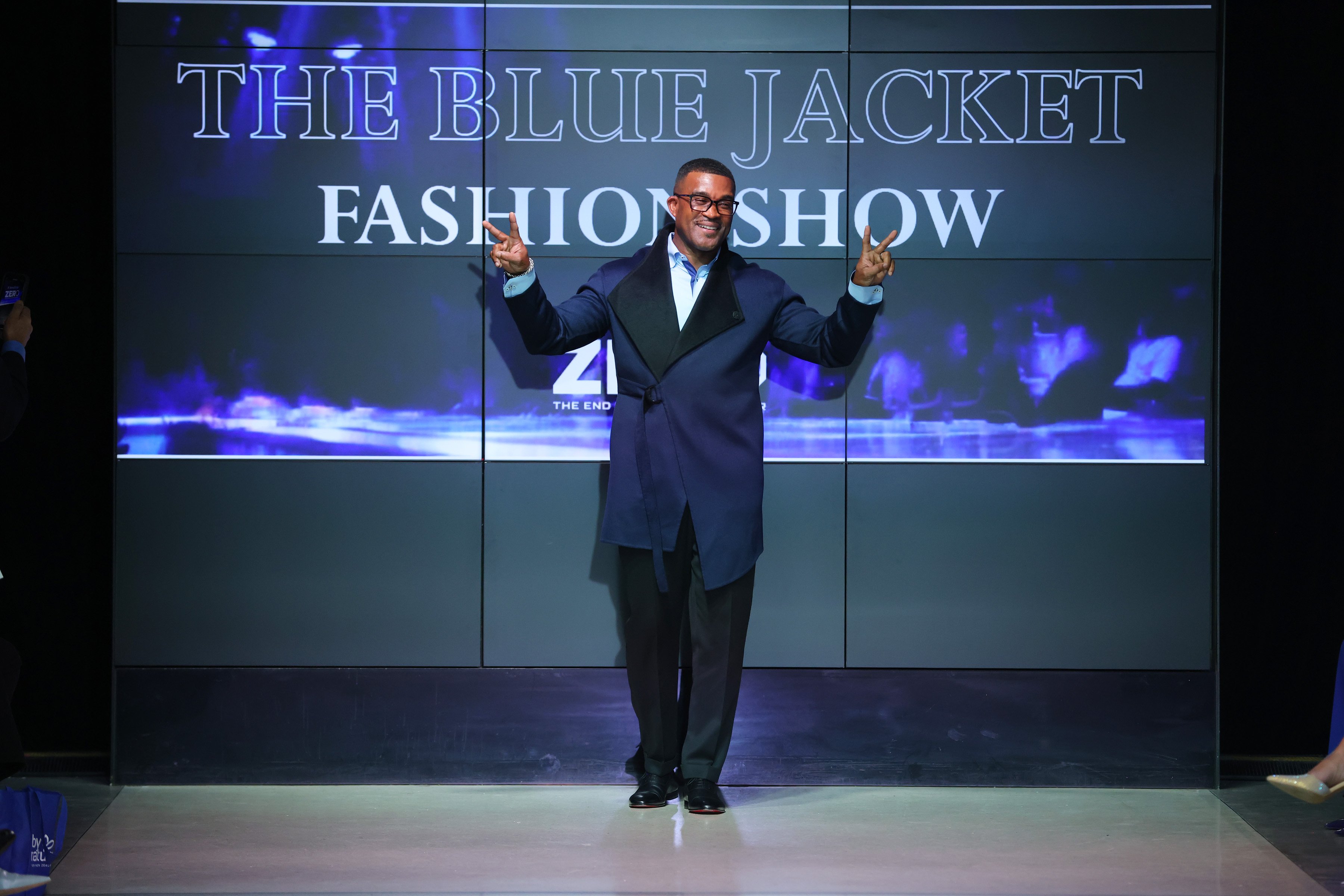 Man in blue jacket on fashion runway