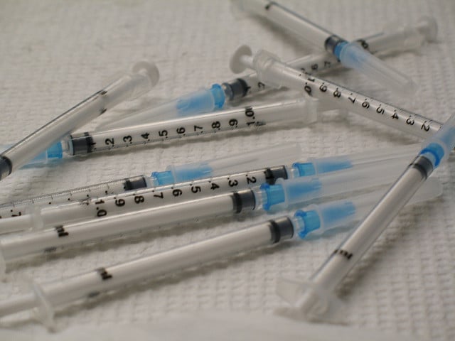 Blue and white syringes