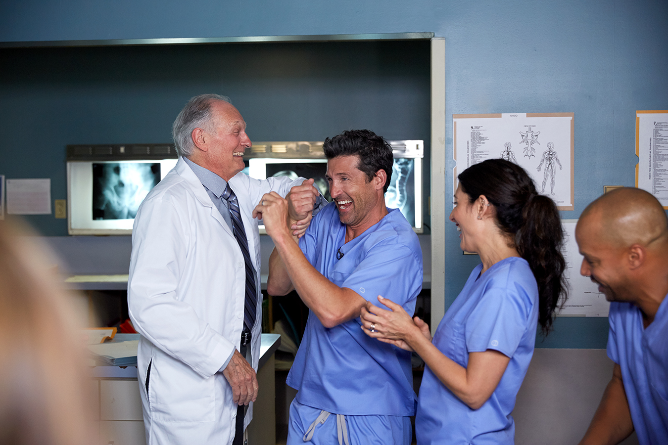 backstage photo of TV doctors laughing