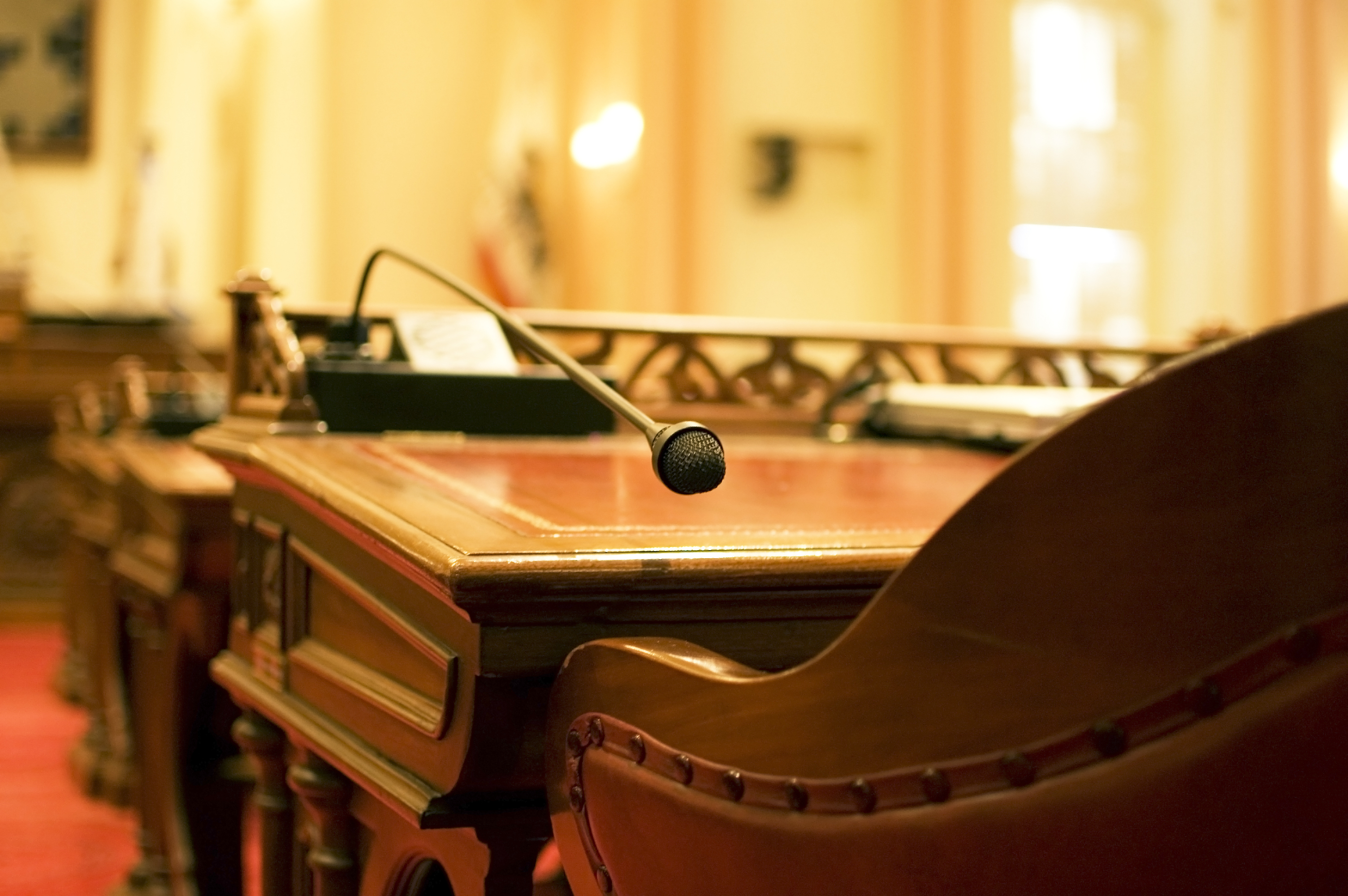 Microphone and empty chair in chamber of Congress