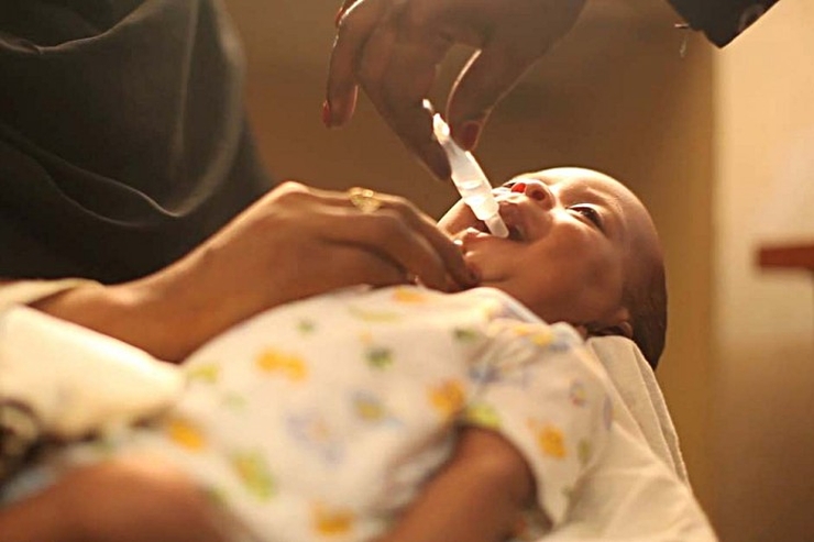 child receiving rotavirus vaccine