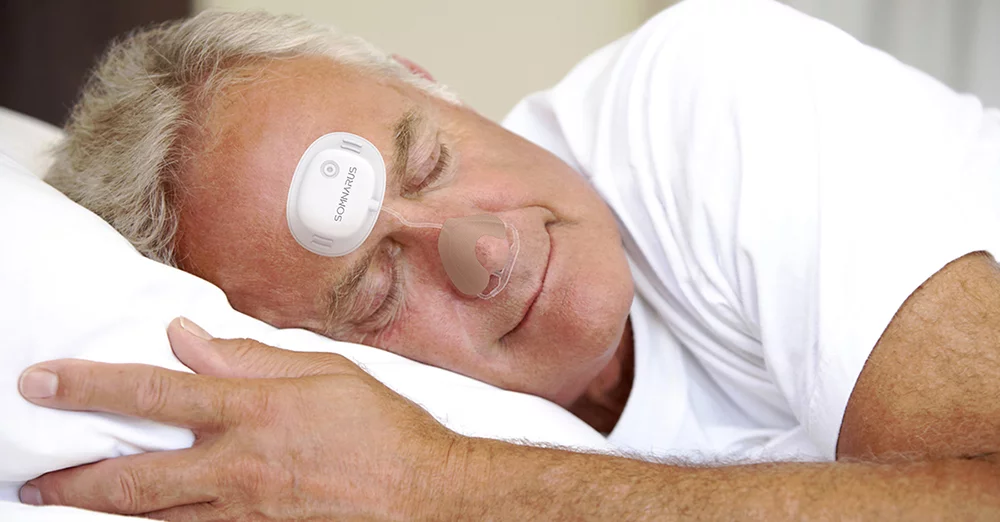 older man sleeping with SomnaPatch placed on face