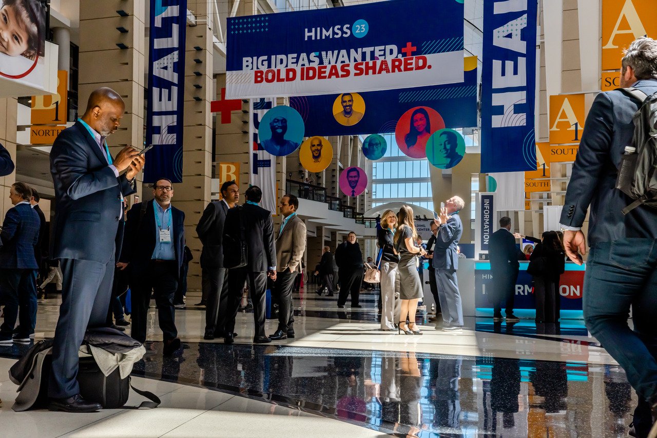 HIMSS 2023 attendees walk through the conference at McCormick Place