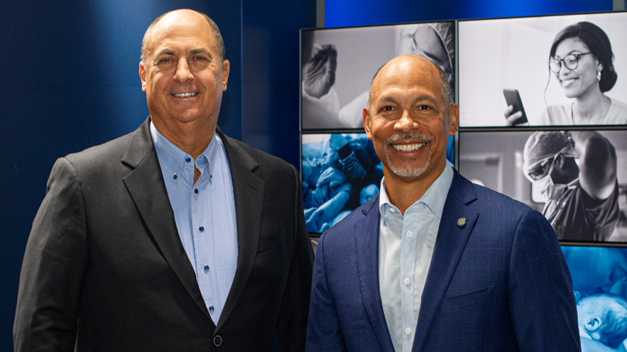 Advocate Aurora Health President and CEO Jim Skogsbergh left and Atrium Health President and CEO Eugene Woods right
