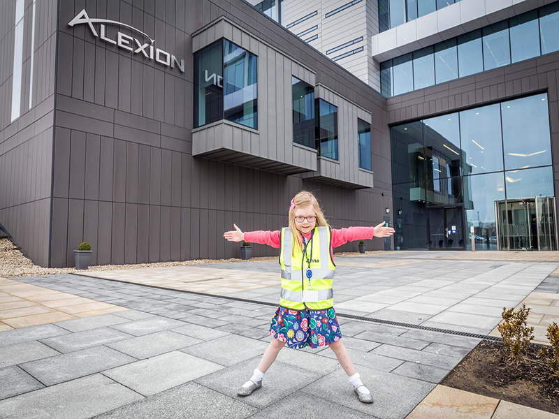 Cute little girl in front of Alexion offices