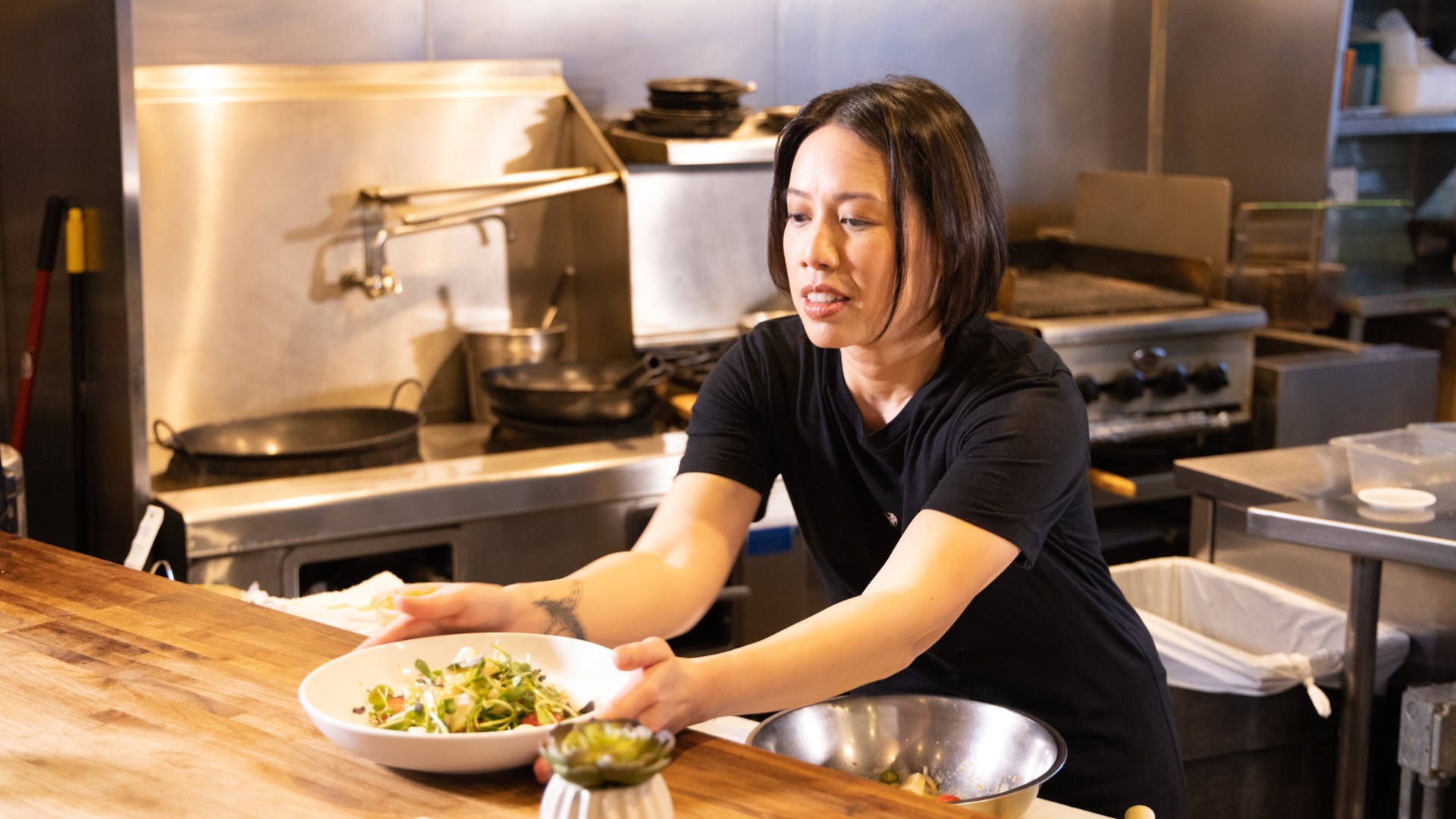 Chef Christine Ha placing a bowl on a kitchen counter