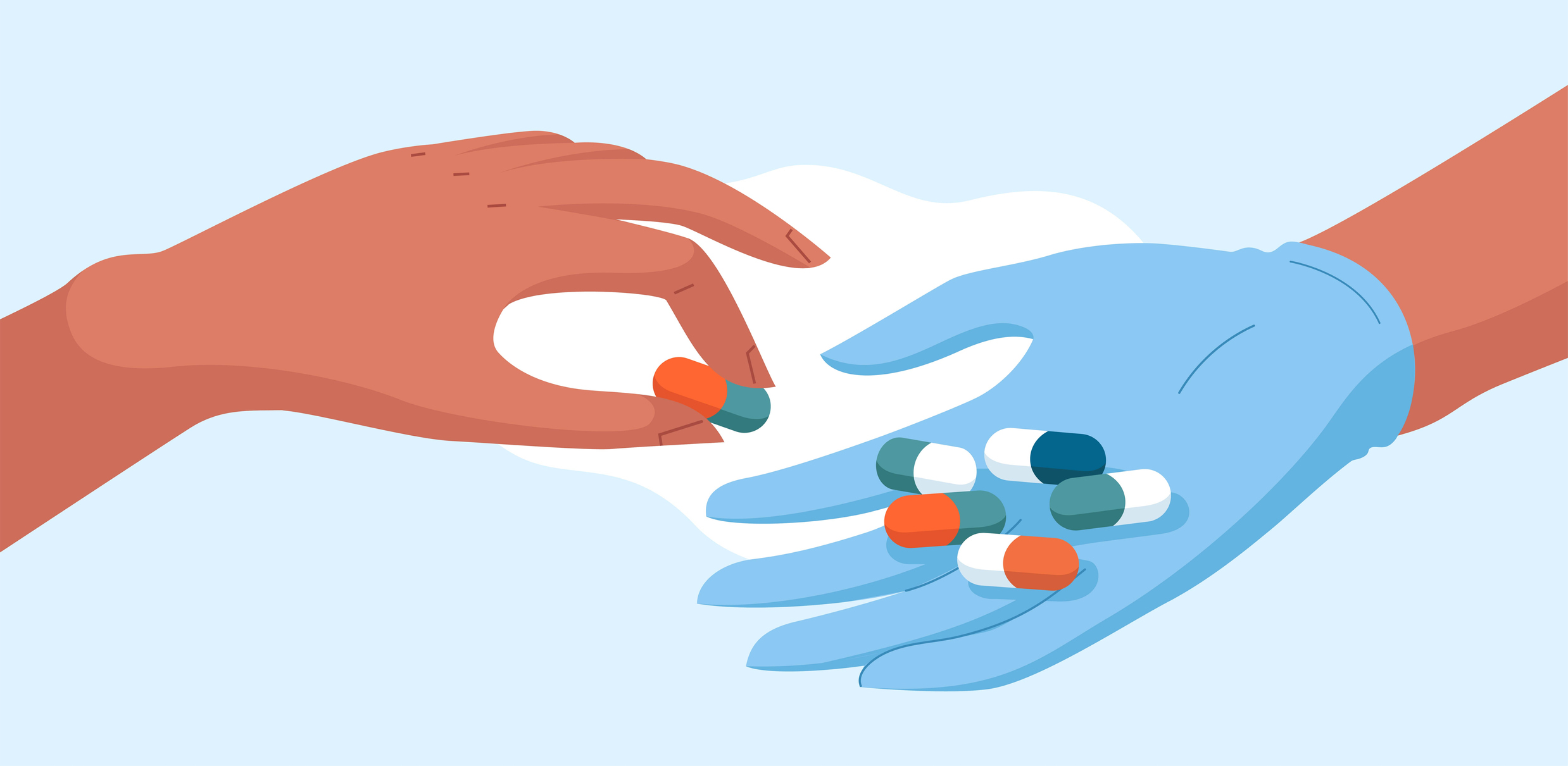 A doctor or nurse with gloves gives a pill to a patient