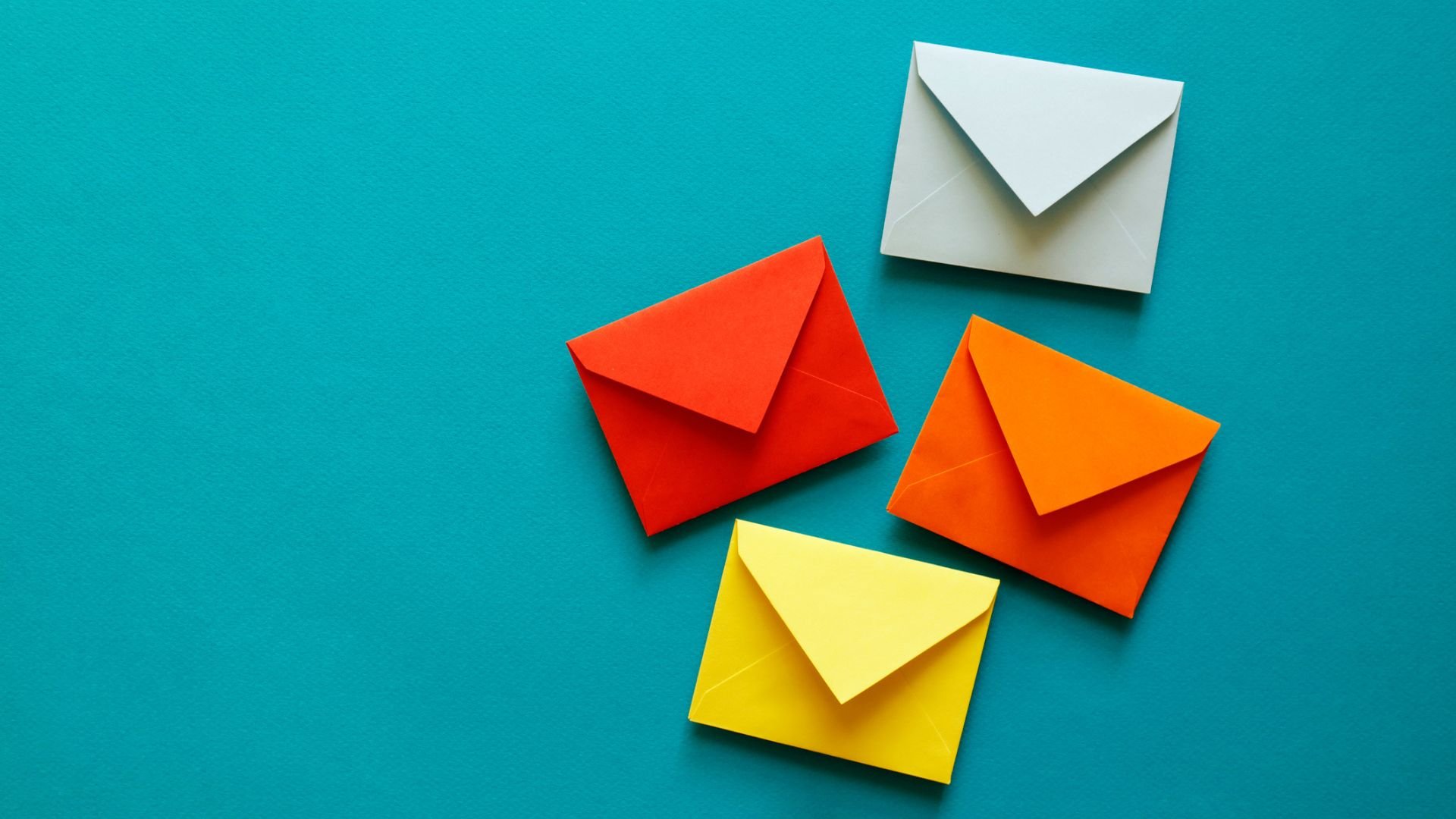 Four multi-colored envelopes