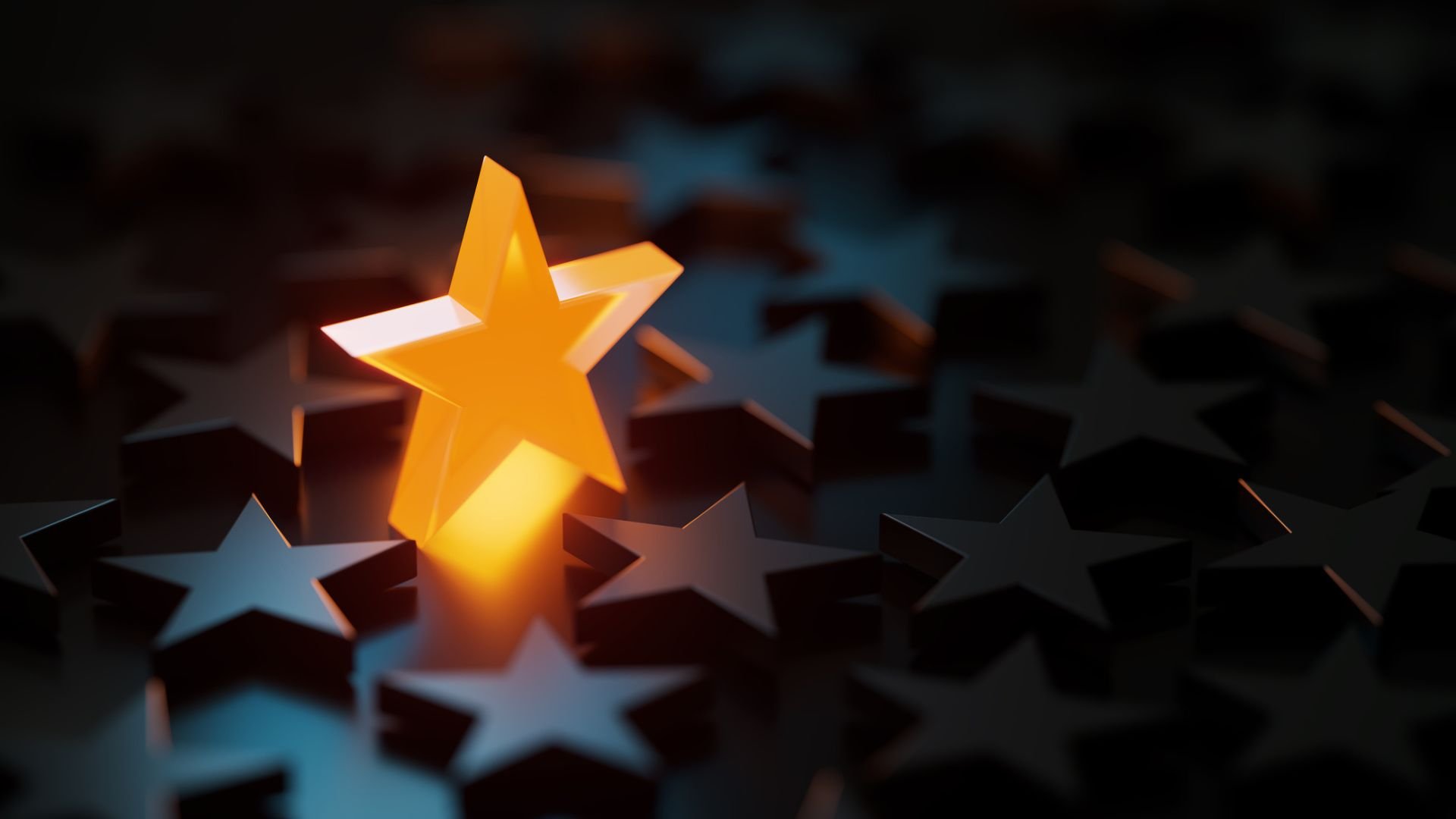 Orange star symbol glowing amid black star symbols on black background