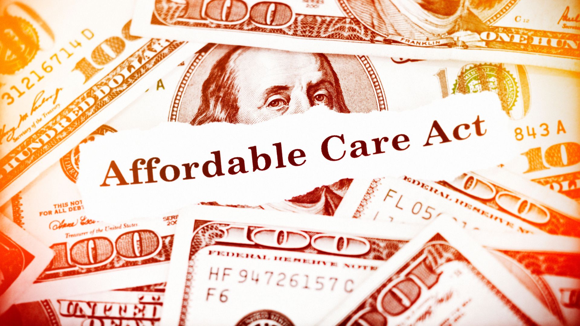 Hundred dollar bills with ACA