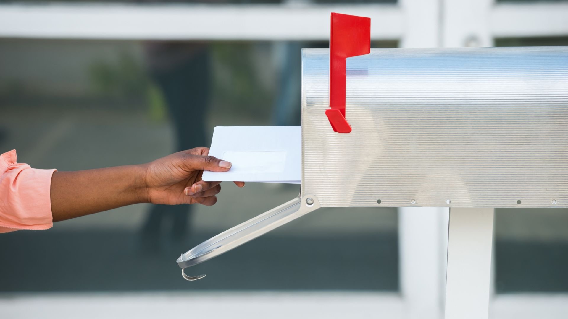 Person getting letters from mailbox