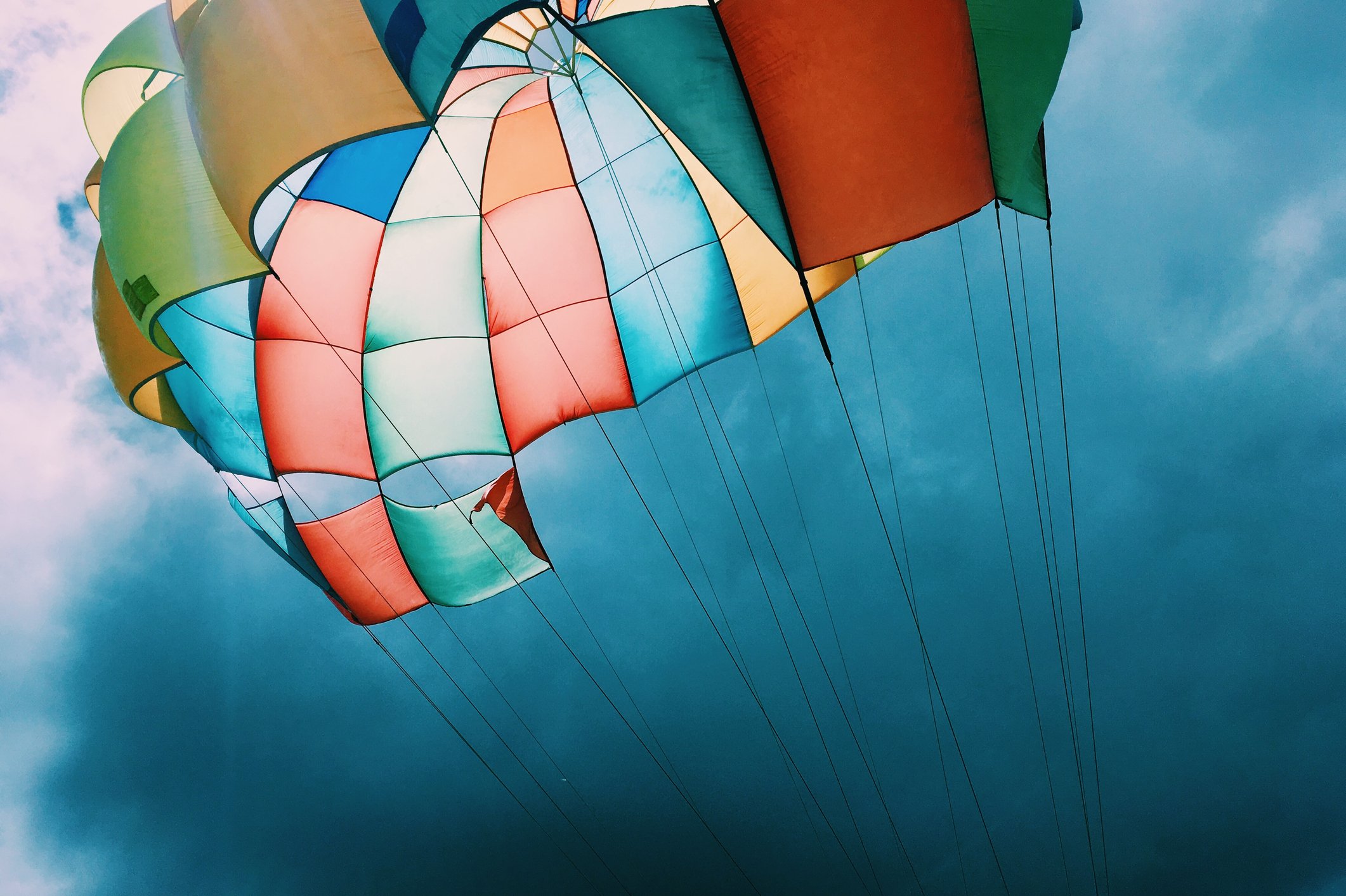 Photo of a parachutes opened with a dark blue sky in the background