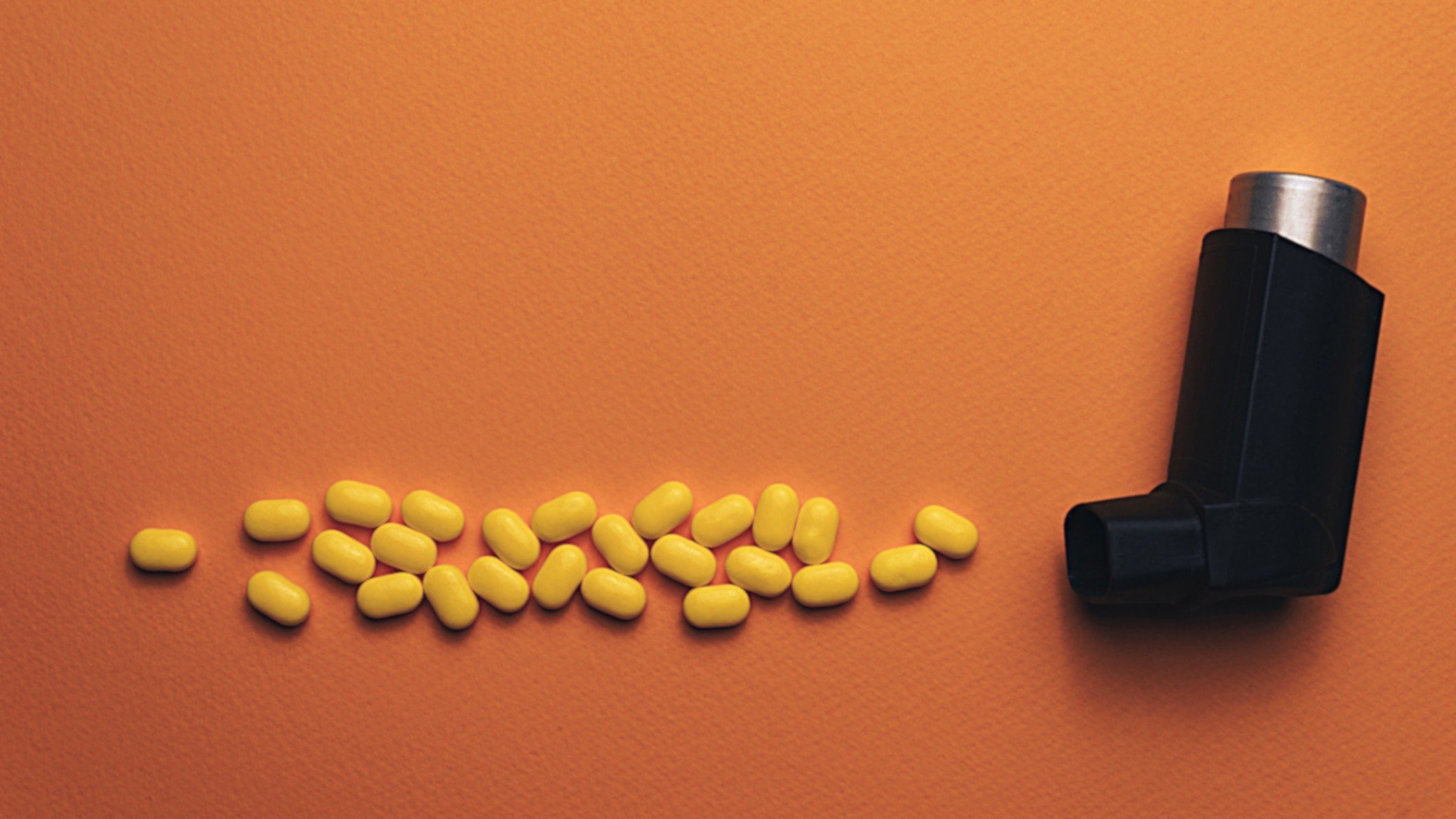 orange pills and black inhaler
