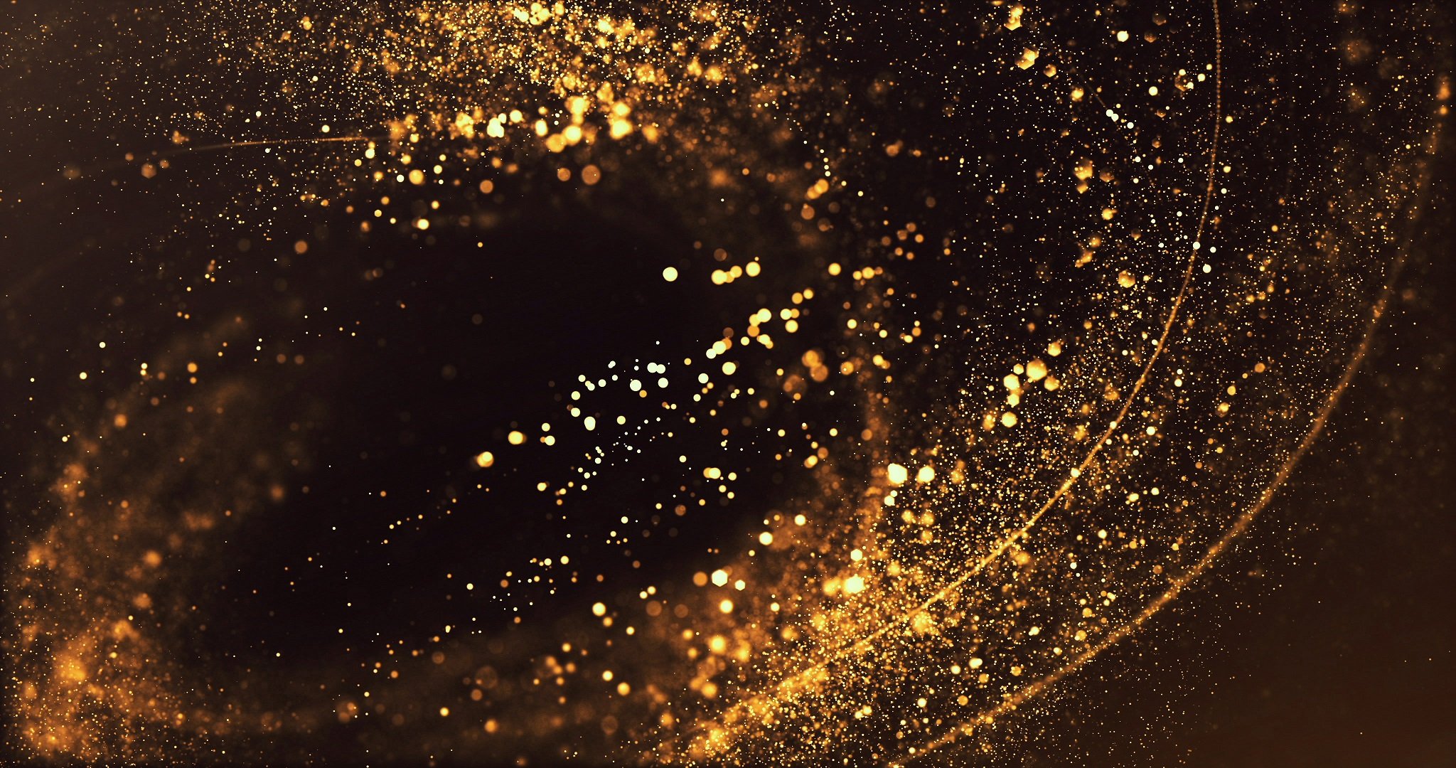 swirling gold particles on dark background