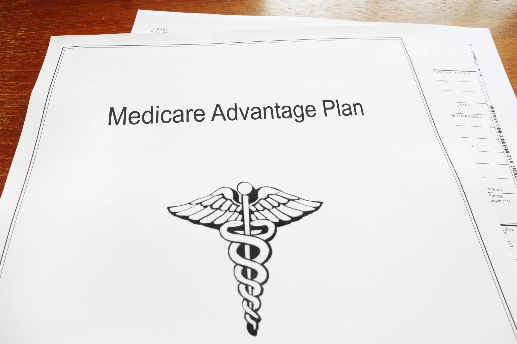 A stack of documents reading Medicare Advantage plan