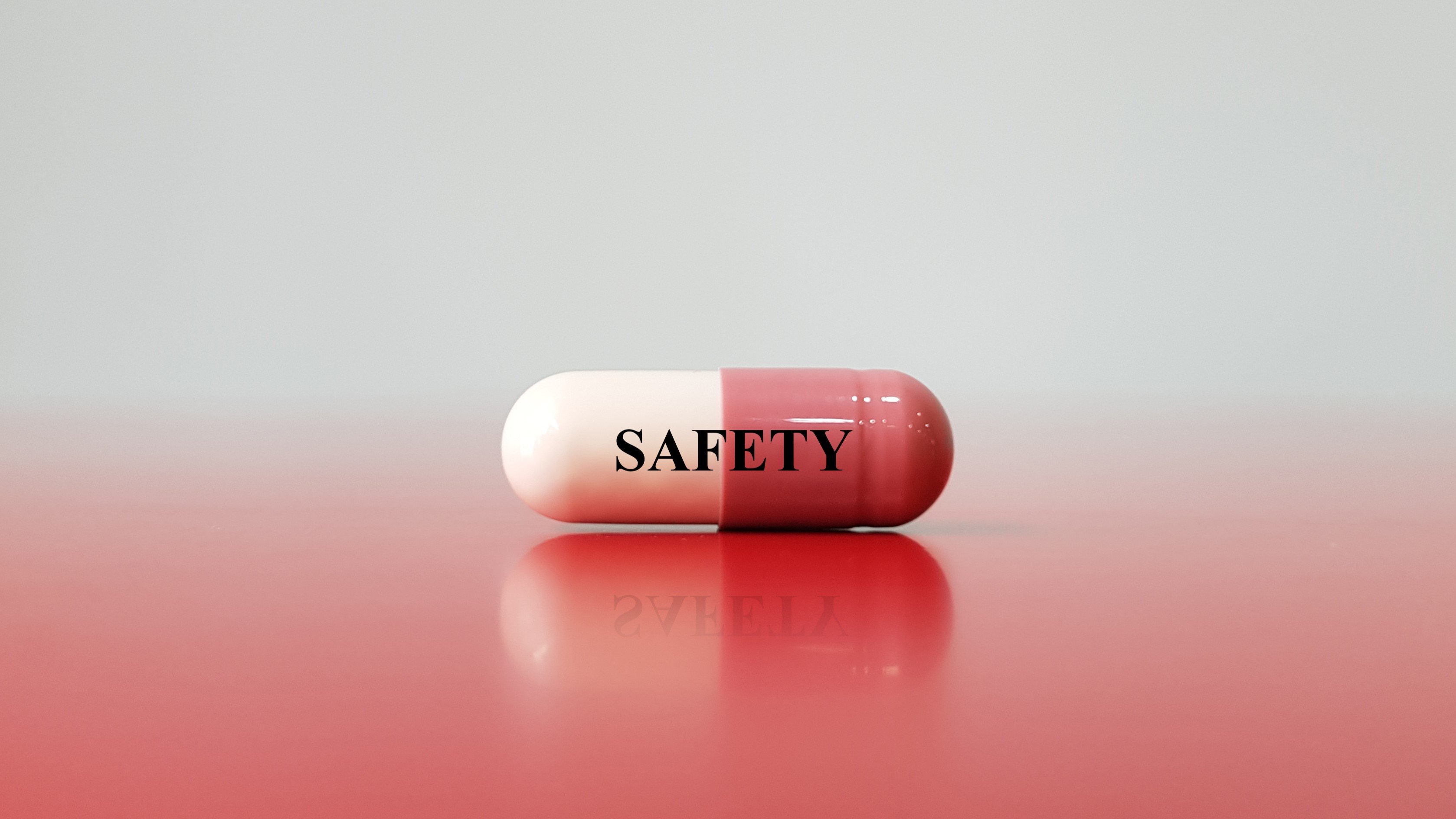 Graphic image of a pill with the words safety on it