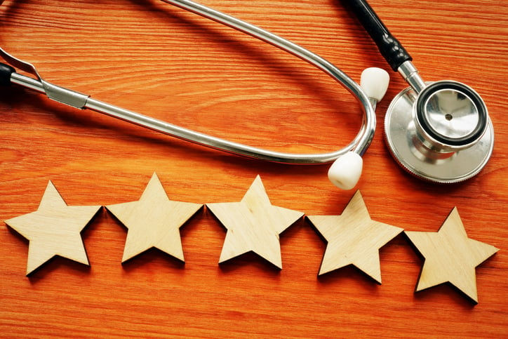 A five-star rating image next to a stethoscope