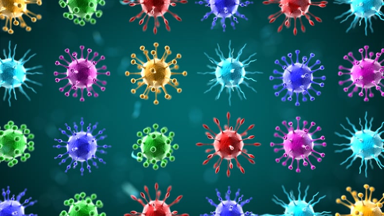 An artists concept of different strains or types of coronaviruses shown in multiple bright colors against a teal background