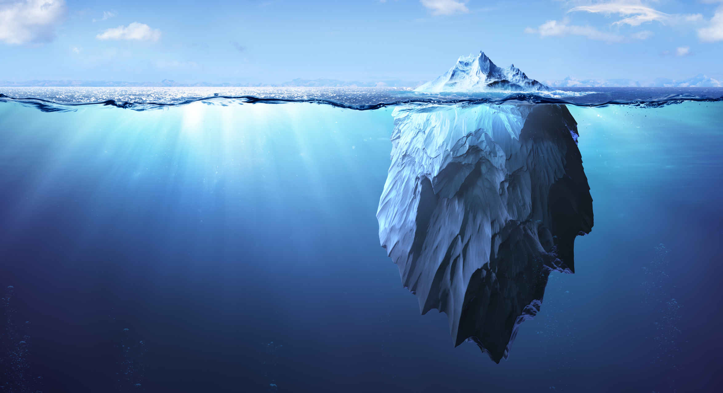Graphic image of an iceberg tip above water with a significant amount of ice below the surface