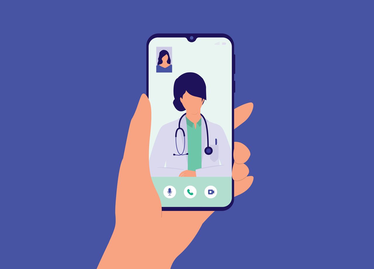 Patient Having Video Call With Female Doctor Online Using Mobile Phone