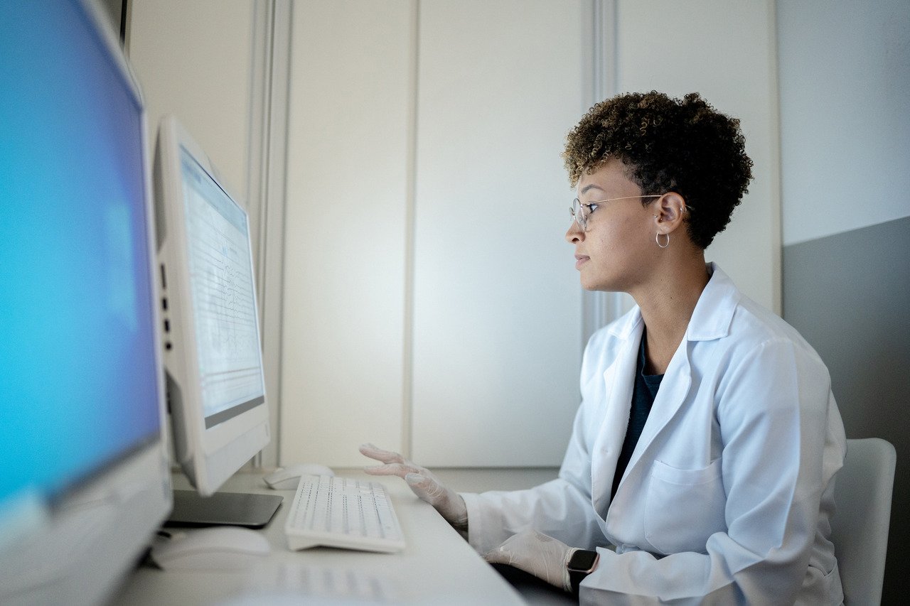 female doctor working at computer at medical clinic
