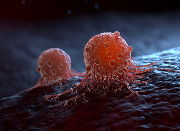 An artists rendering of cells in the midst of metastasis The cells are bright red with round shadows on them They appear 