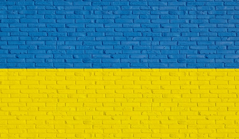 Brick wall with colors of Ukrainian flag