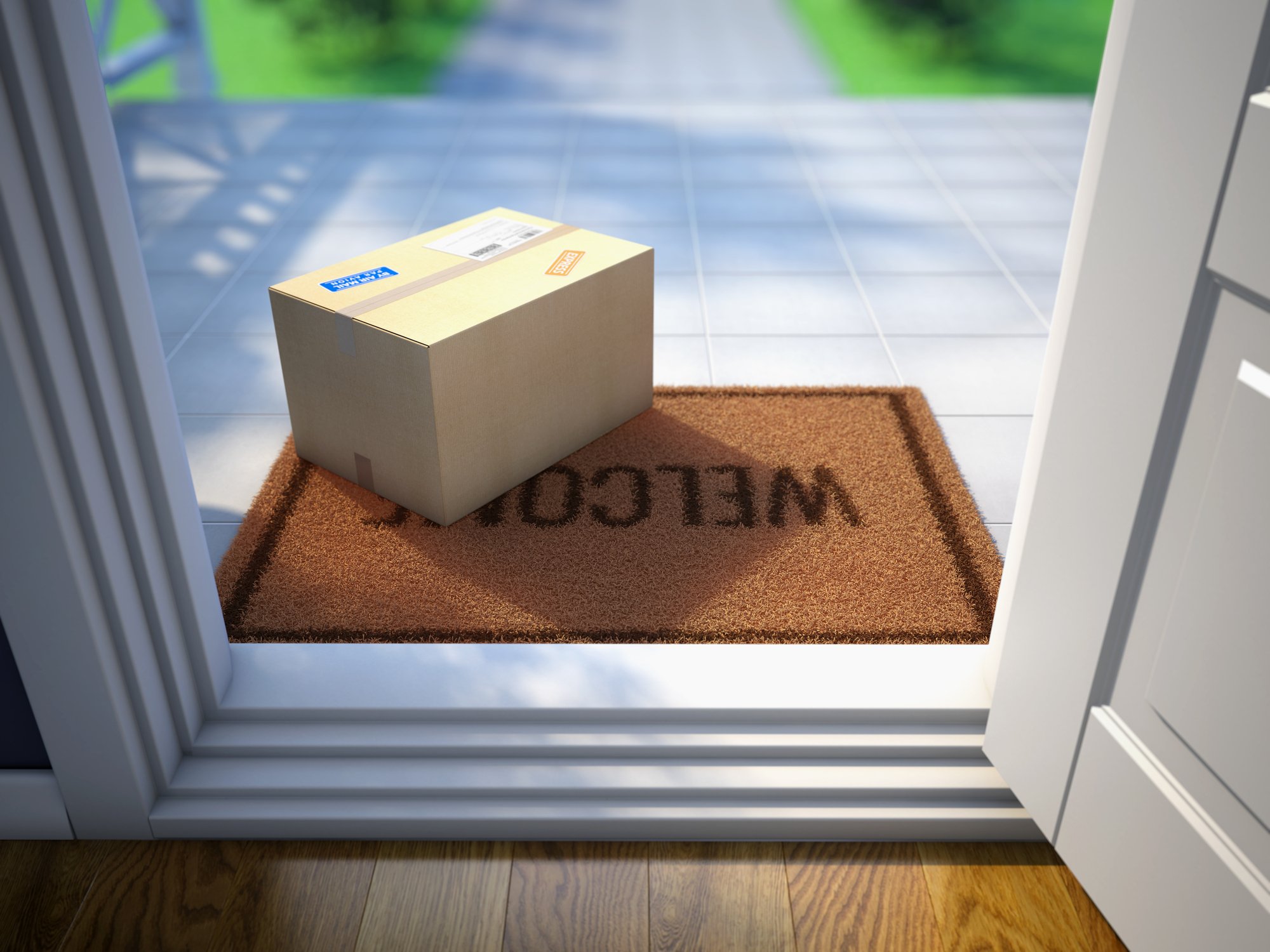 Graphic image of a cardboard box delivered to a doorstep with a welcome mat