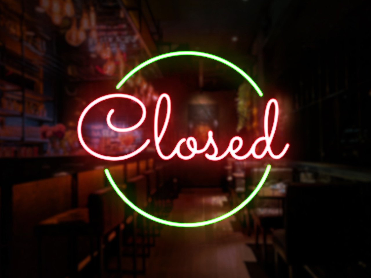 neon closed sign in window