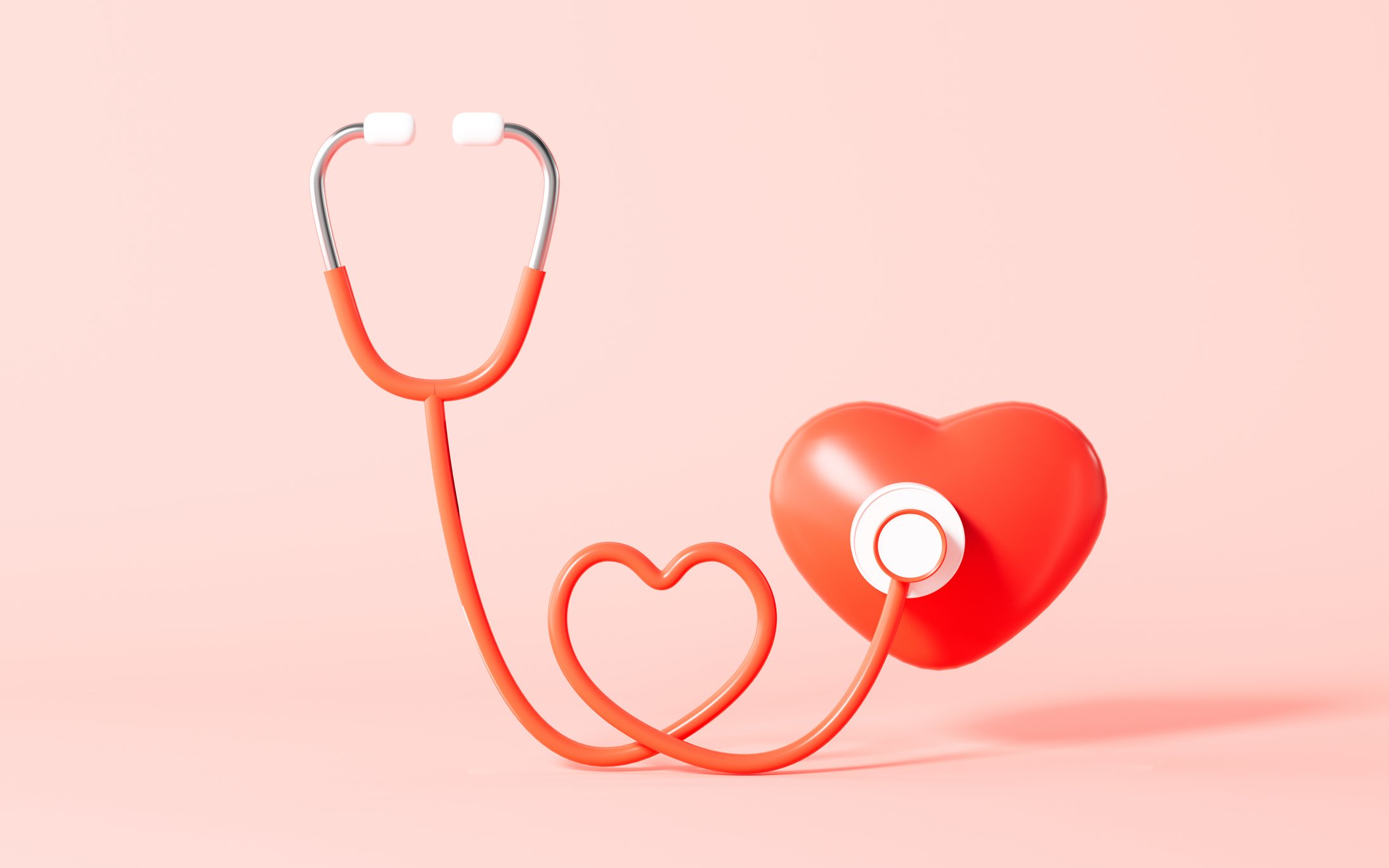 Stethoscope and red heart with pink background